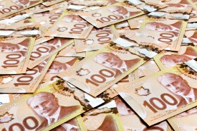USD/CAD Retreats After Touching Highest in Month