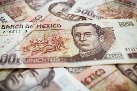 Mexican Peso Weakens Below 14 per Dollar